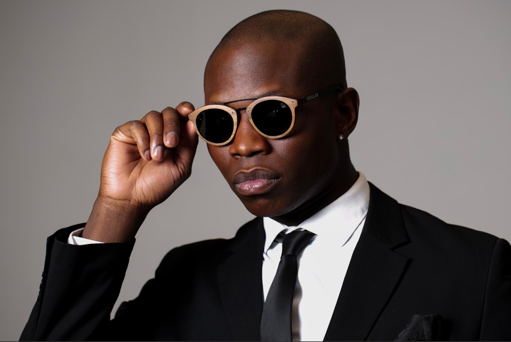 Man in suit with wooden sunglasses