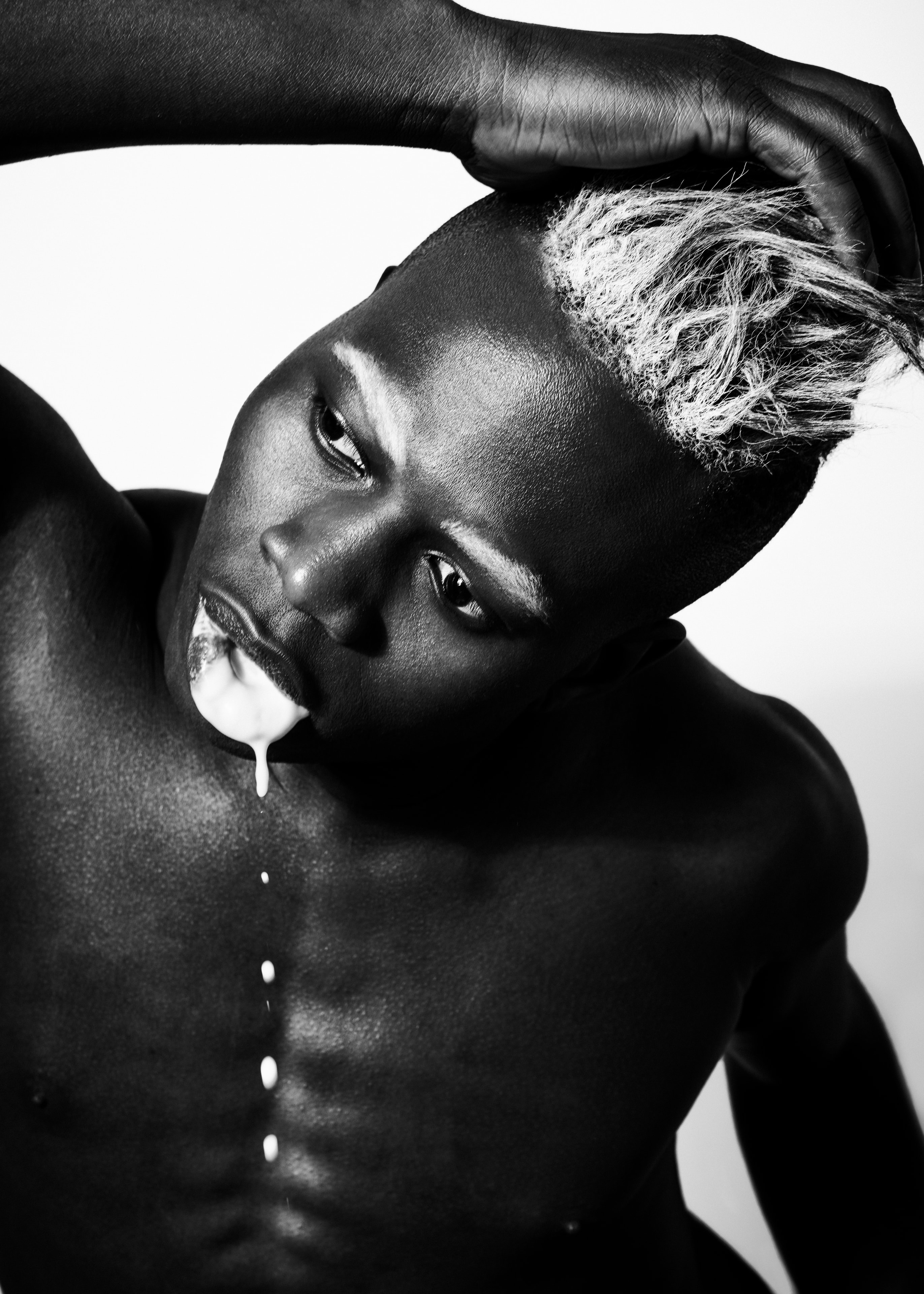 Black and white studio portrait with bleached hair